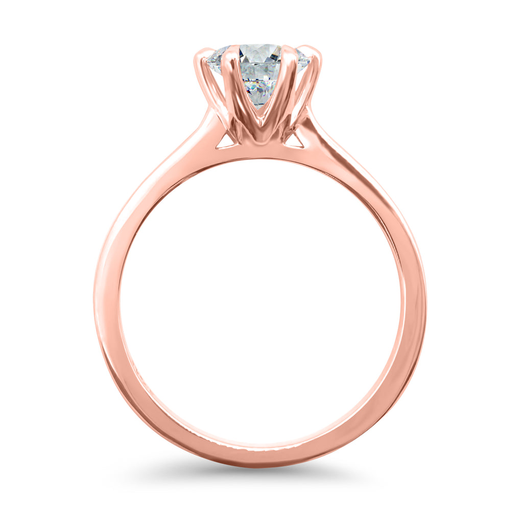 Vertical side view of a 1 carat round solitaire engagement ring with 6 prongs, IGI certified F/VS2, in 14k rose gold.