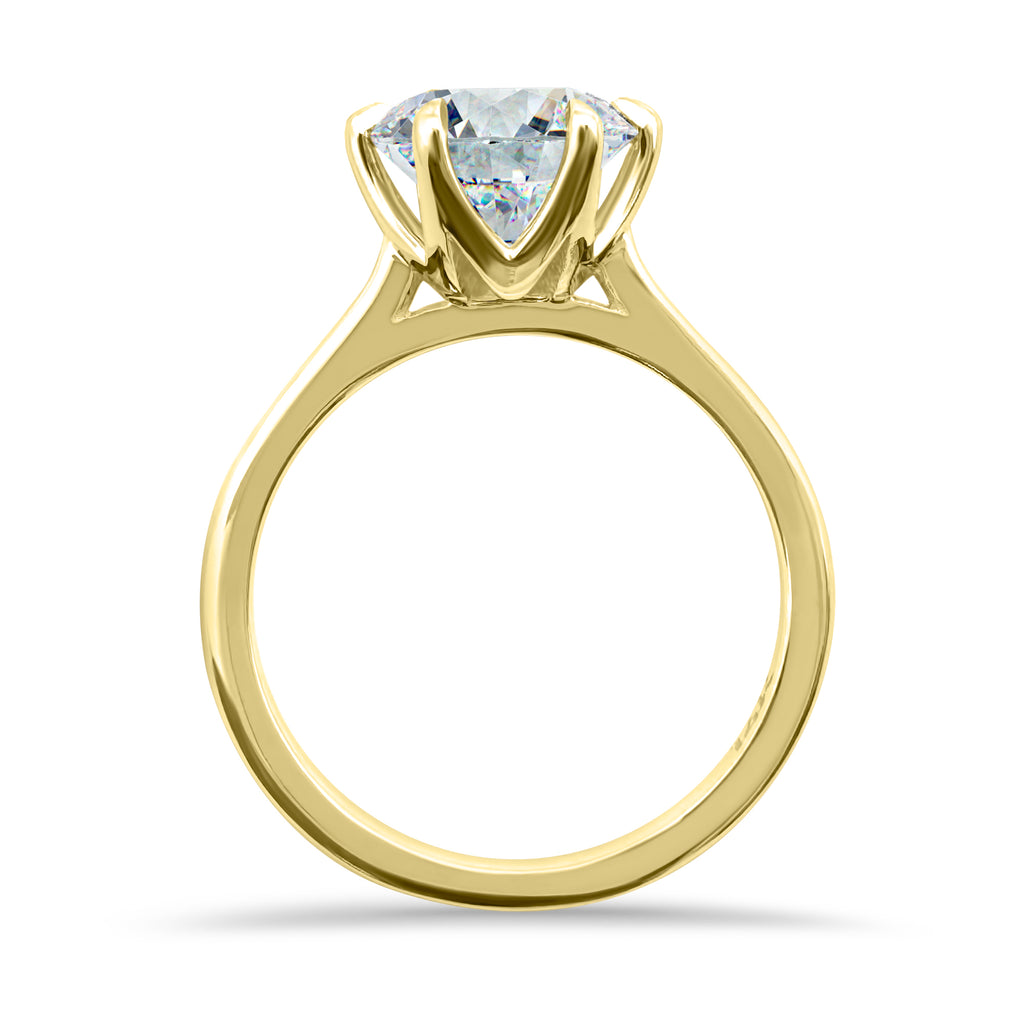 Vertical side view of a 2 carat round solitaire engagement ring with a 6-prong setting, IGI certified F/VS2, in 14k yellow gold.